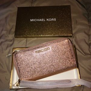 Michael Kors sparkly pink wallet.
